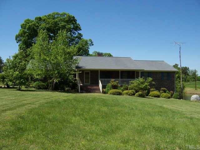 a view of a house with garden and a garden