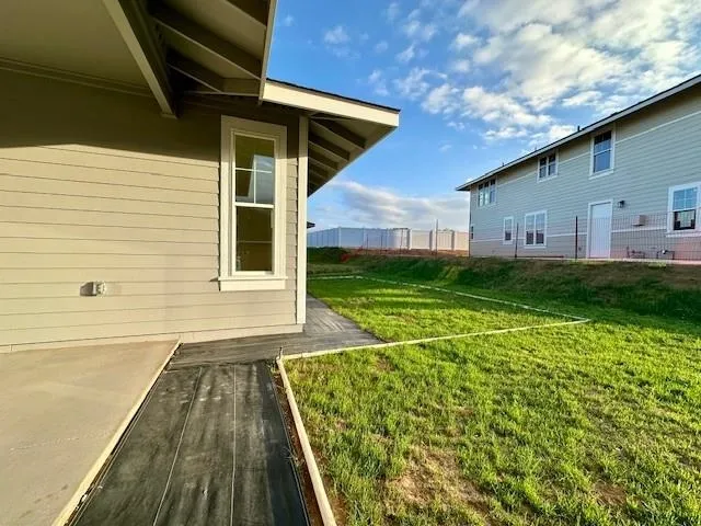 a view of a backyard of the house