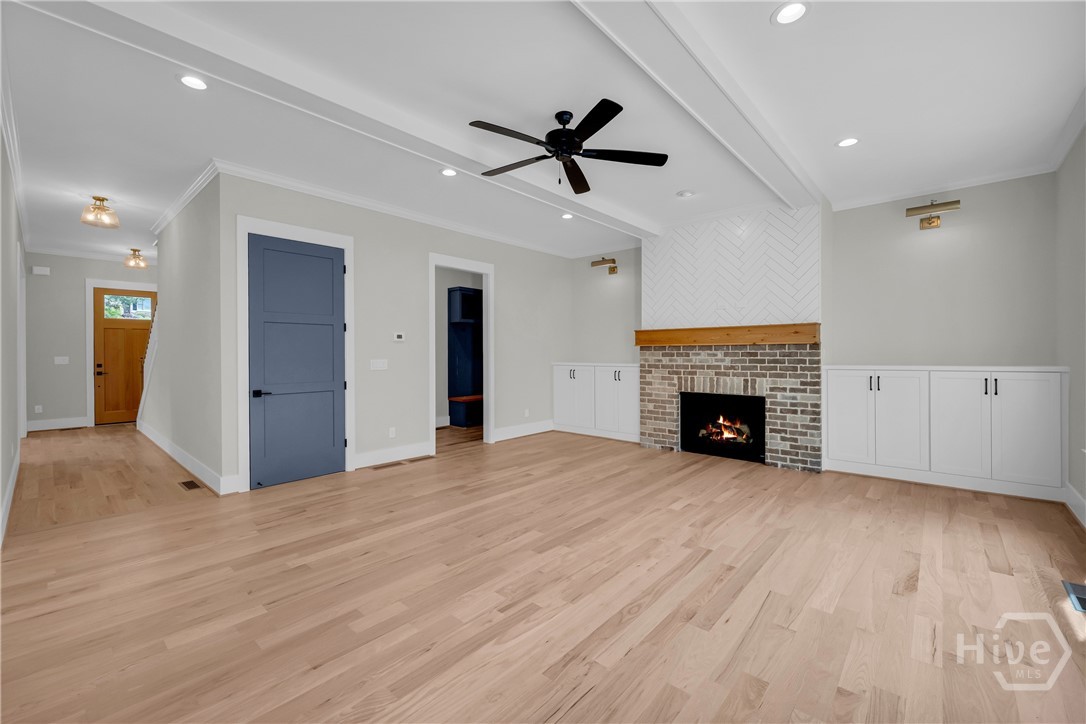 2476 St Martin Way Monroe, GA 30656 - Photo 8 of 75 Spacious family room featuring light wood-finish flooring and 10-ft ceilings on main floor