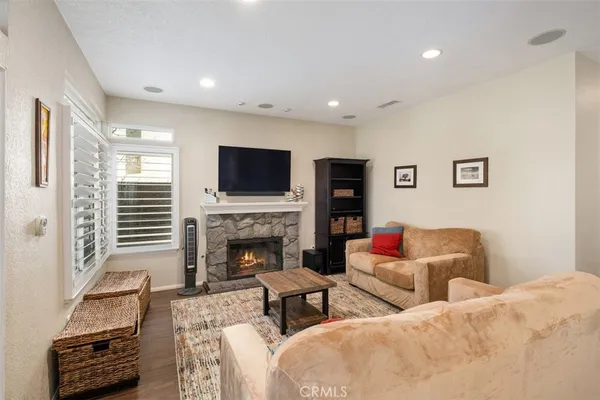 a living room with furniture and a fireplace