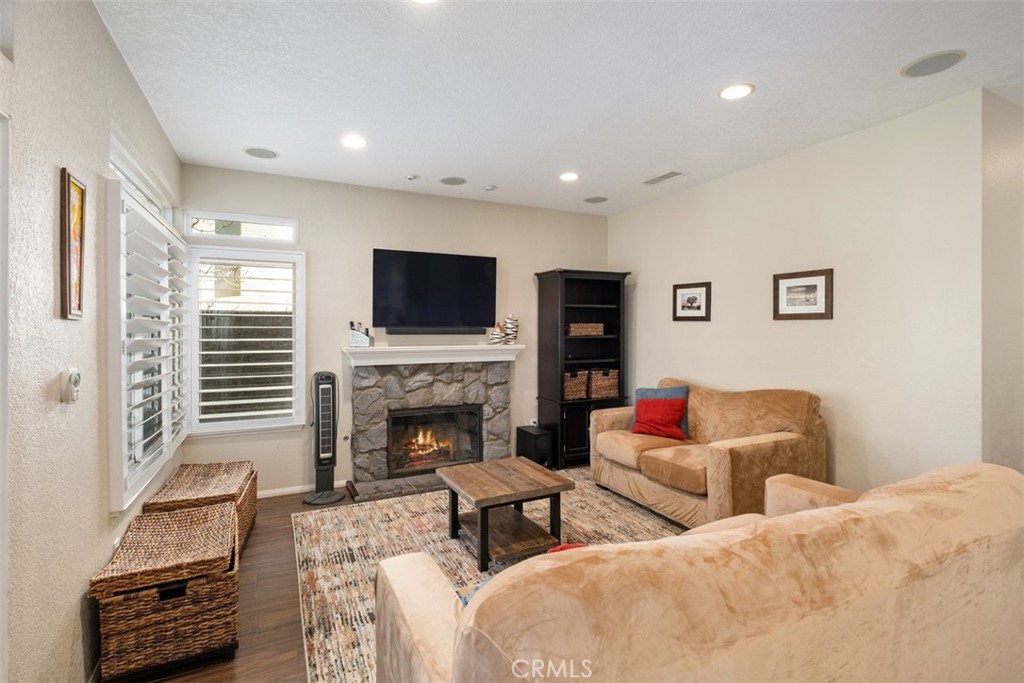 20891 Porter Ranch Road Rancho Santa Margarita, CA 92679 - Photo 16 of 40 a living room with furniture and a fireplace
