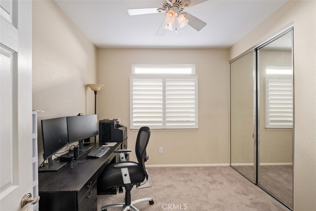 20891 Porter Ranch Road Rancho Santa Margarita, CA 92679 - Photo 17 of 40 a view of a workspace with furniture and a window