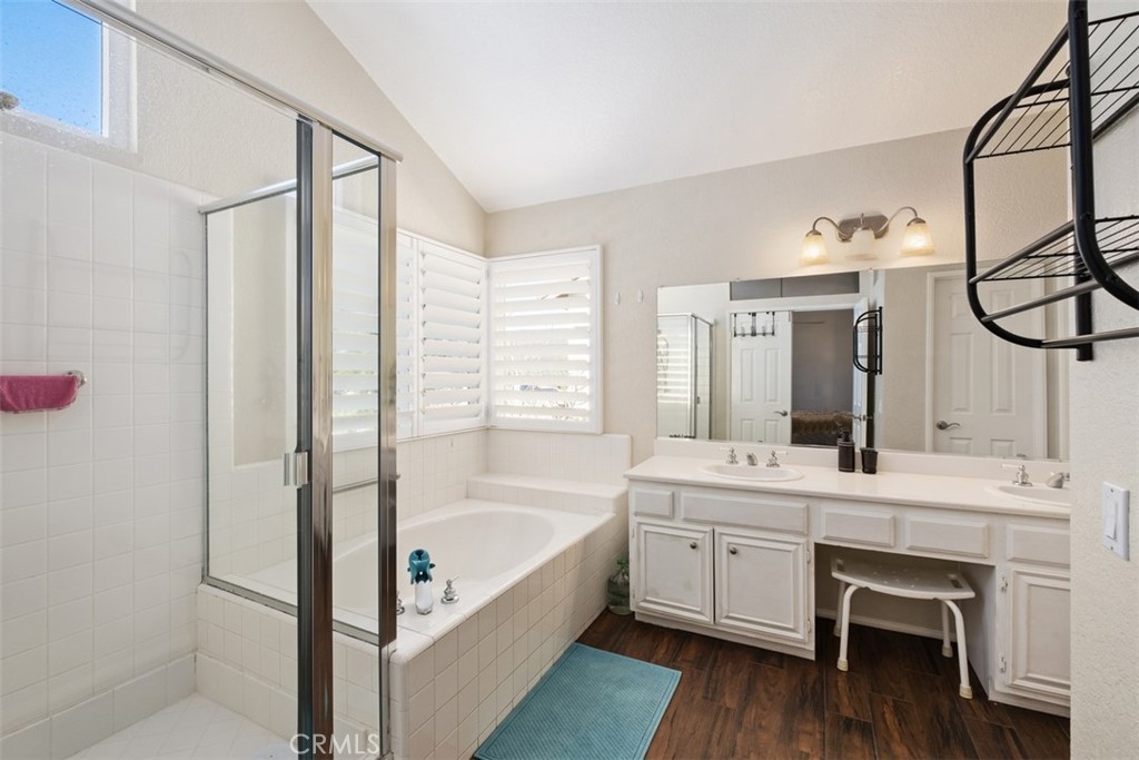 20891 Porter Ranch Road Rancho Santa Margarita, CA 92679 - Photo 22 of 40 a bathroom with a tub sink and mirror