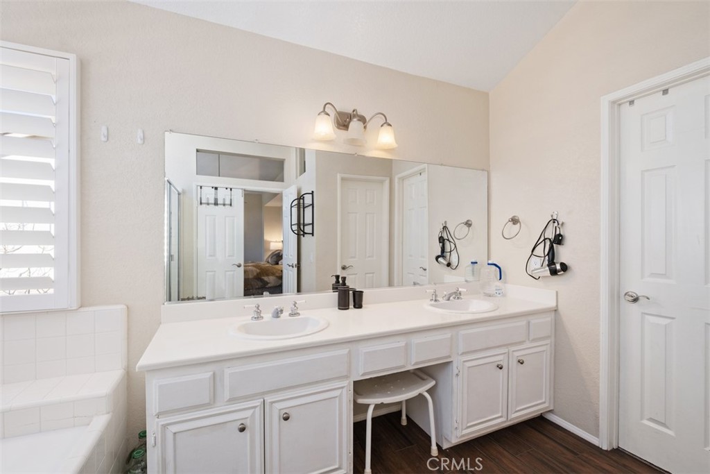 20891 Porter Ranch Road Rancho Santa Margarita, CA 92679 - Photo 23 of 40 a bathroom with double vanity sinks a vanity and a mirror