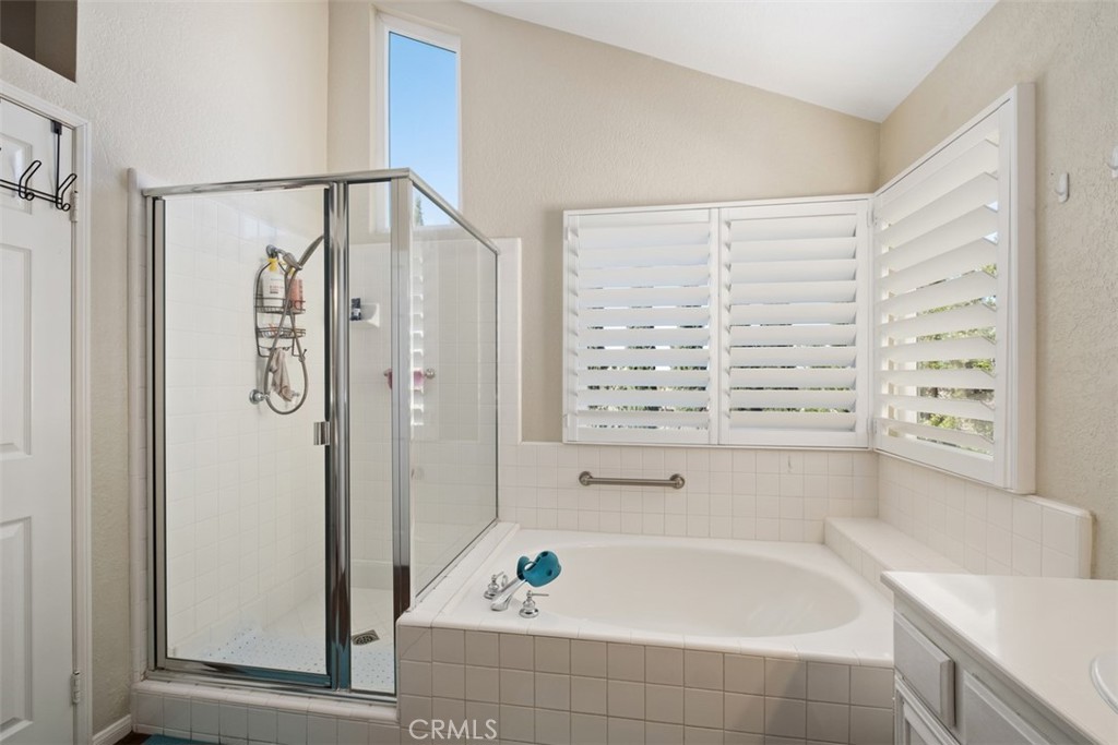 20891 Porter Ranch Road Rancho Santa Margarita, CA 92679 - Photo 24 of 40 a bathroom with a bathtub and a shower