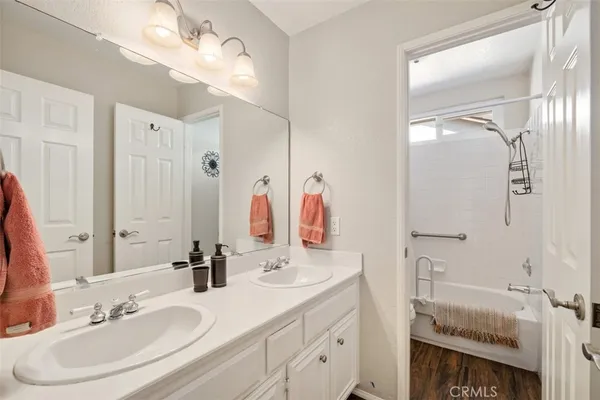 a view of a chair and tables in the patio in front of a house
