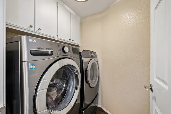 a view of a house with a swimming pool and a yard