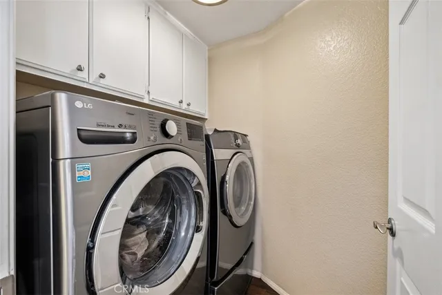 a view of a porch with a table chairs and a yard