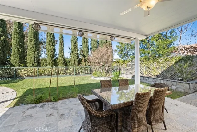 a view of a dining room with furniture wooden floor and chandelier