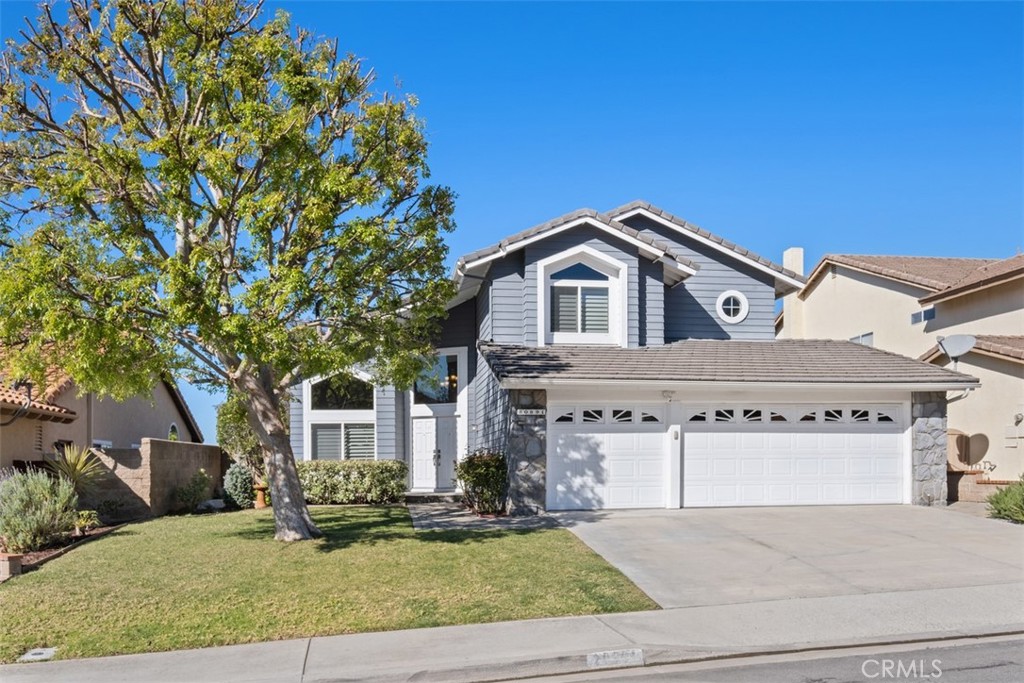 20891 Porter Ranch Road Rancho Santa Margarita, CA 92679 - Photo 39 of 40 a front view of a house with a yard