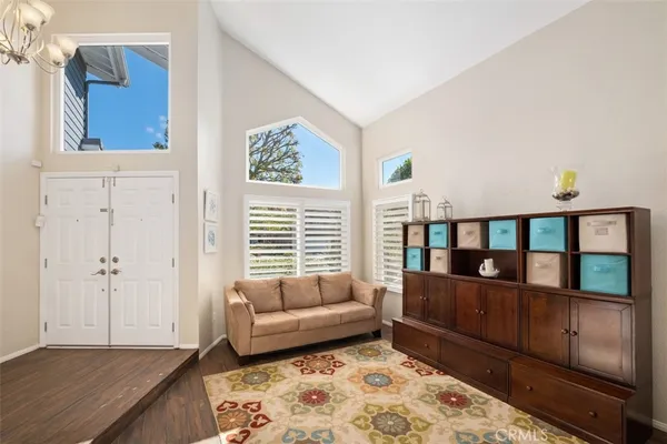 a living room with furniture and a window