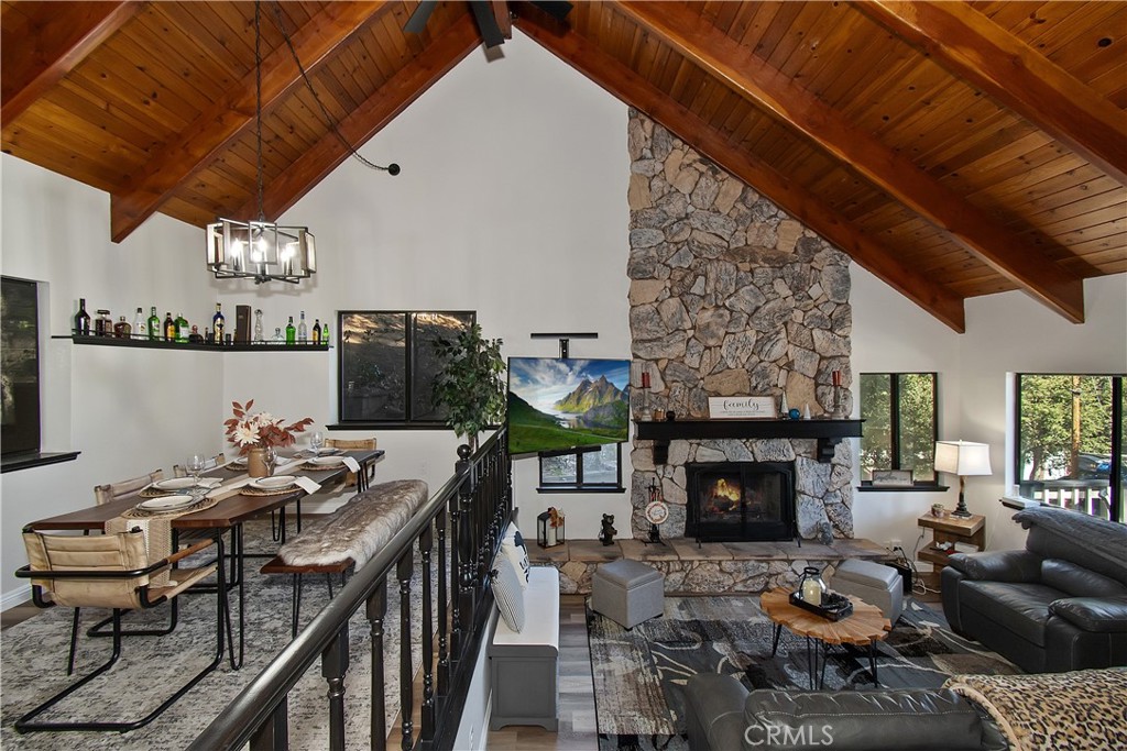 198 Zermatt Drive Crestline, CA 92325 - Photo 13 of 54 a living room with furniture a fireplace and a table