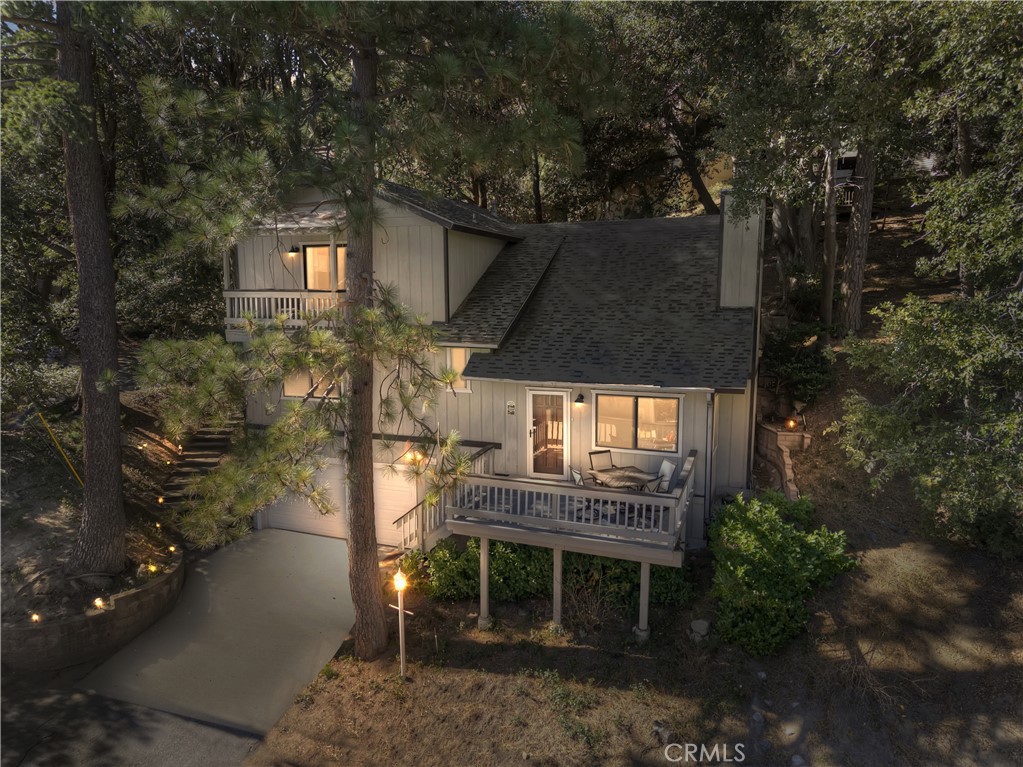 198 Zermatt Drive Crestline, CA 92325 - Photo 2 of 54 a front view of house with a garden