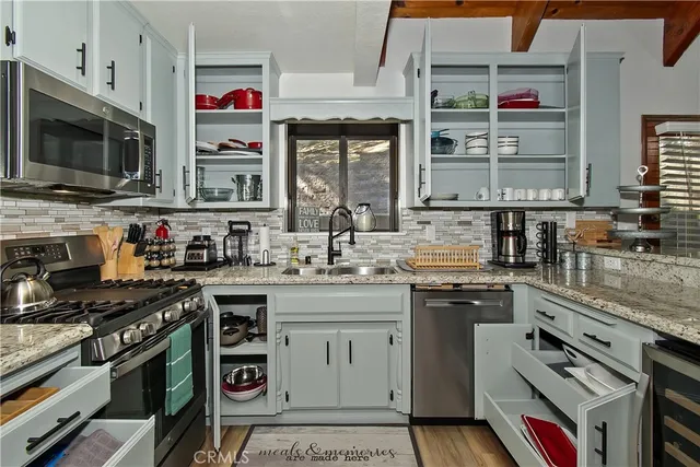 a view of living room with furniture and wooden floor