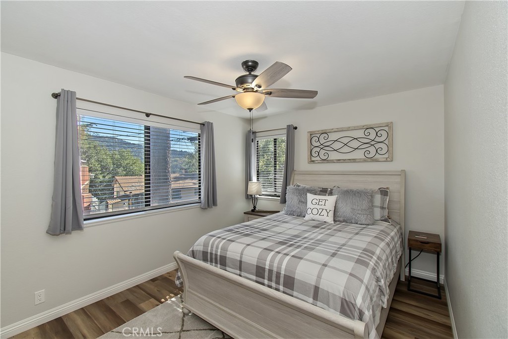 198 Zermatt Drive Crestline, CA 92325 - Photo 23 of 54 a bedroom with a large bed and a window