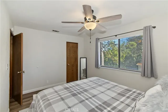 a bed room with a bed and window