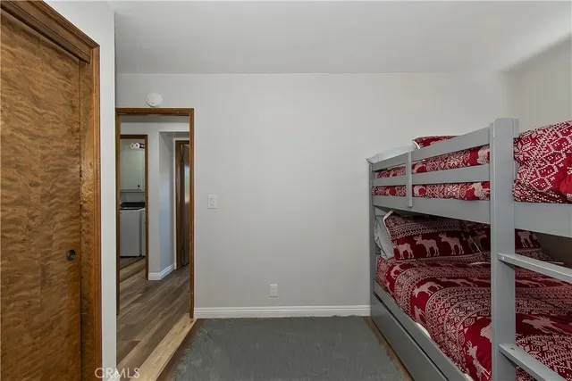 a bed room with a bed and a window