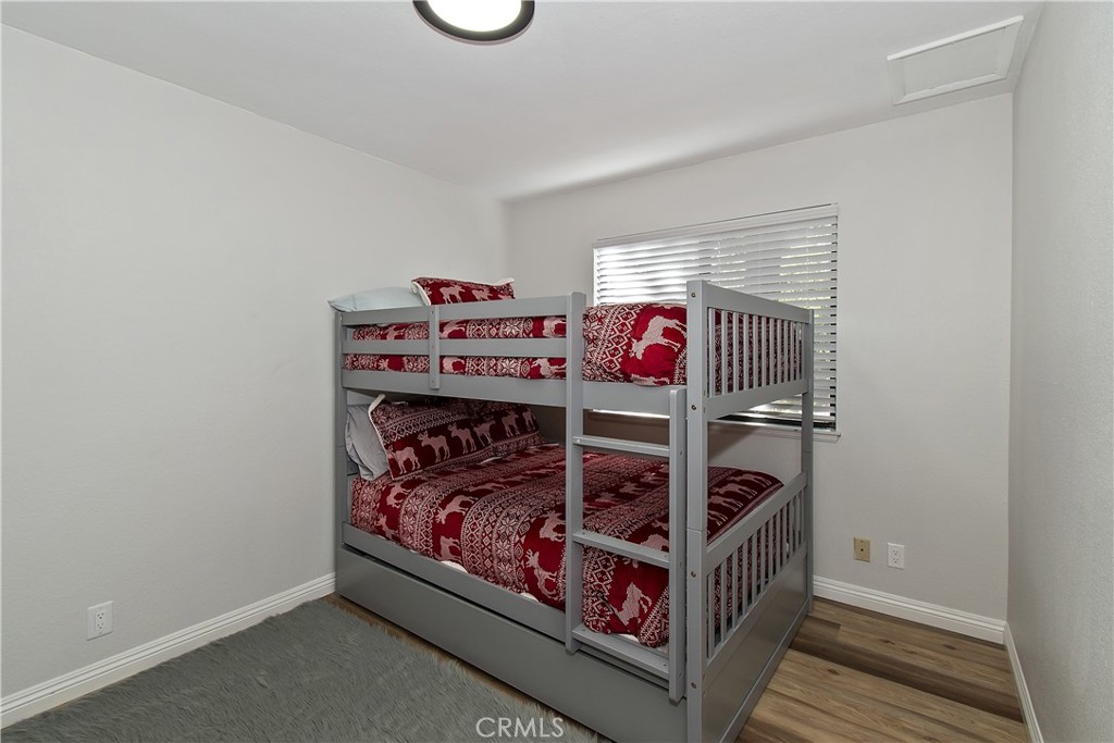 198 Zermatt Drive Crestline, CA 92325 - Photo 27 of 54 a bed room with a bed and a window