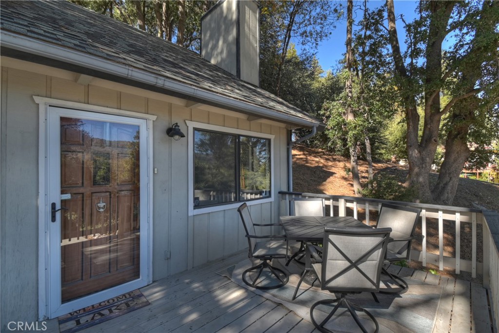 198 Zermatt Drive Crestline, CA 92325 - Photo 40 of 54 a view of a patio with table and chairs and potted plants