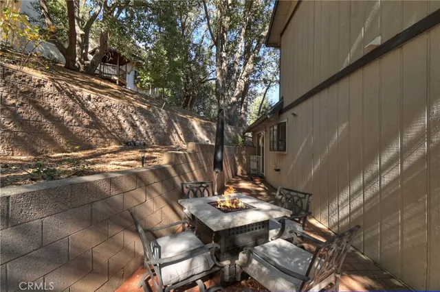 a backyard of a house with a large tree