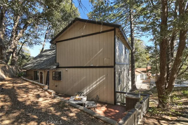 a backyard of a house with a large tree