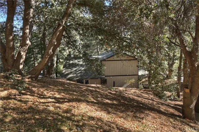 an aerial view of residential house and sandy dunes