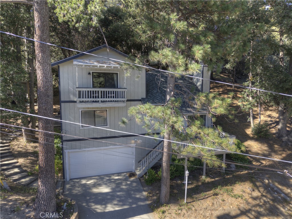 198 Zermatt Drive Crestline, CA 92325 - Photo 5 of 54 a backyard of a house with lots of green space