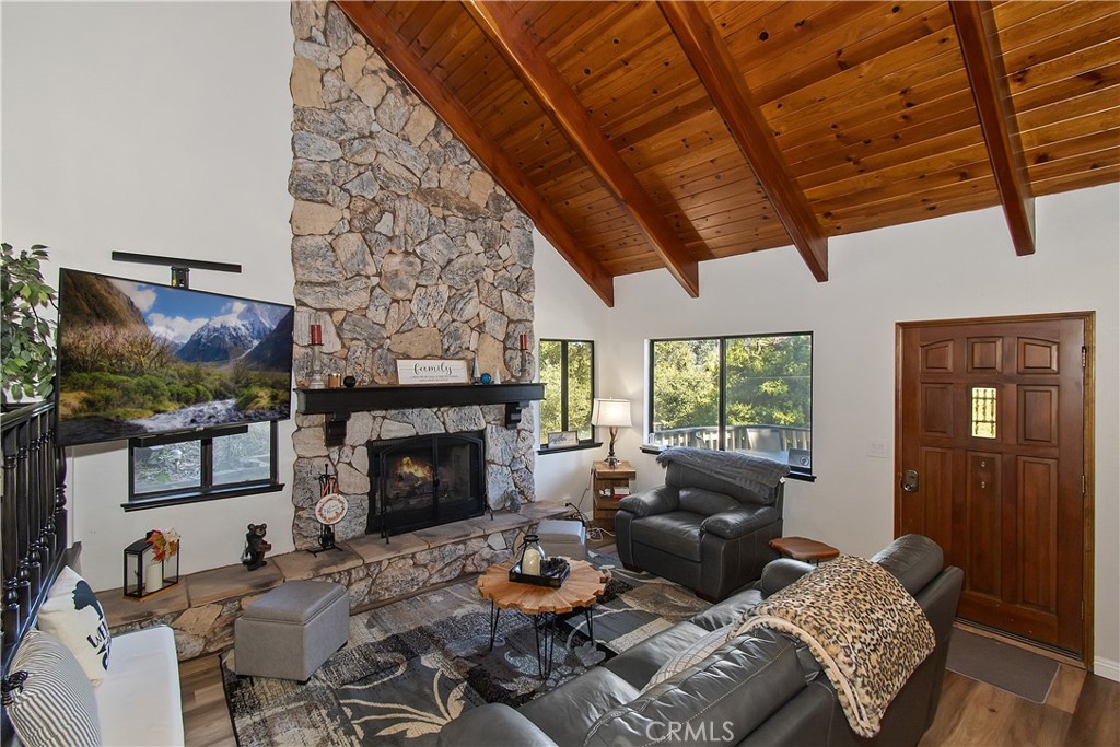 198 Zermatt Drive Crestline, CA 92325 - Photo 7 of 54 a living room with furniture a fireplace and a flat screen tv