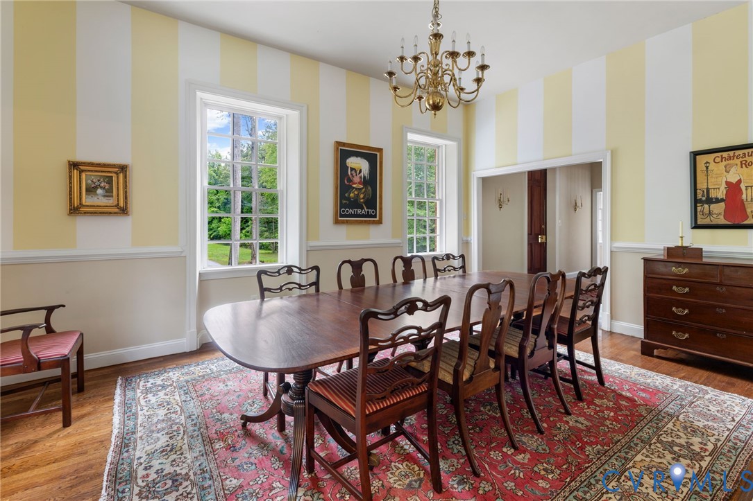 13173 Scotchtown Road Beaverdam, VA 23015 - Photo 29 of 65 a view of a dining room with furniture window and wooden floor