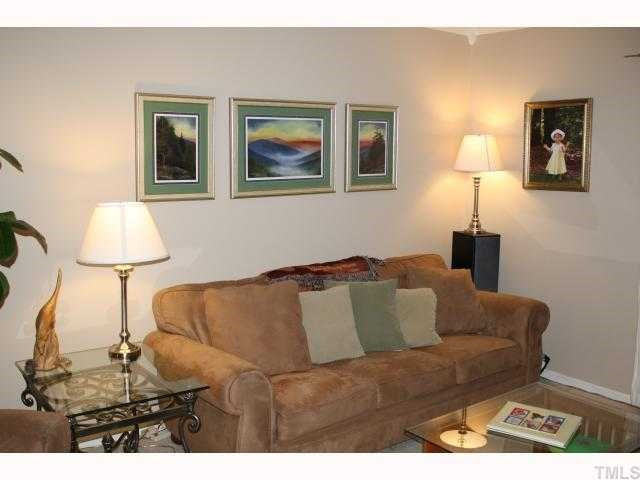 1400 Seaton Road Durham, NC 27713 - Photo 2 of 12 a living room with furniture and a lamp