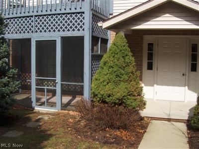 142 Holl Road Northeast, Unit A North Canton, OH 44720 - Photo 1 of 1 Secure entry to the building. Charming screened porch accessible from living room.
