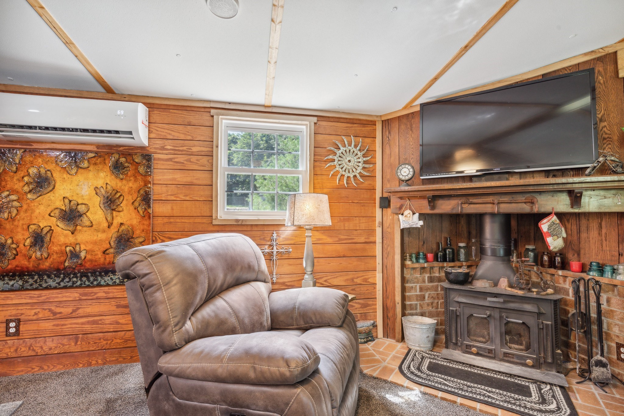 3611 Cooper Nicholson Road Pleasant View, TN 37146 - Photo 23 of 60 a living room with furniture a flat screen tv and a floor to ceiling window