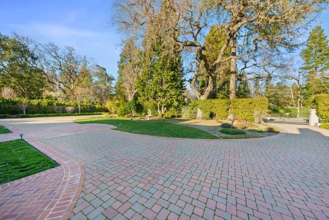 a view of yard with swimming pool