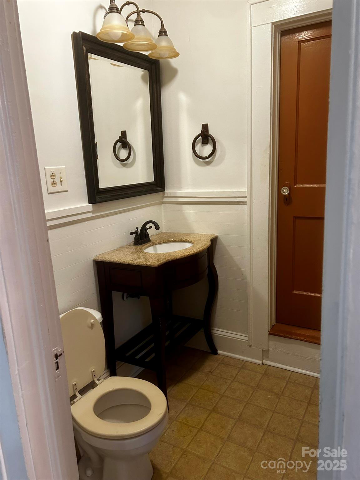 404 Huffman Street Morganton, NC 28655 - Photo 13 of 29 a bathroom with a toilet and a sink
