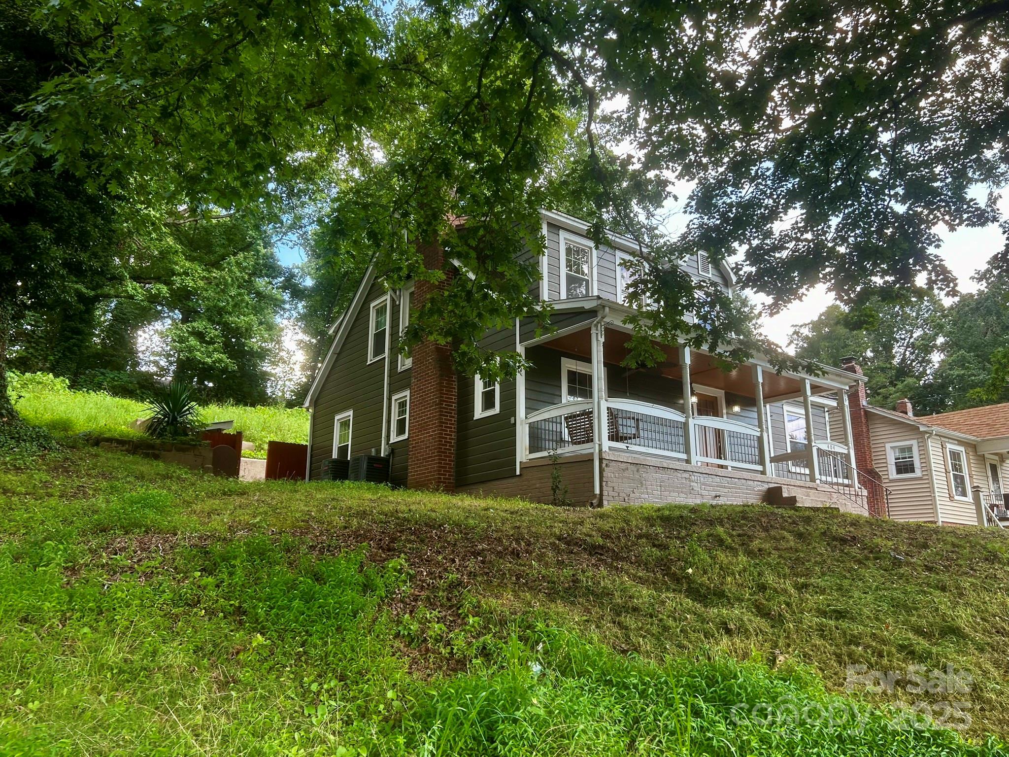 404 Huffman Street Morganton, NC 28655 - Photo 2 of 29 a view of a house with a yard and sitting area