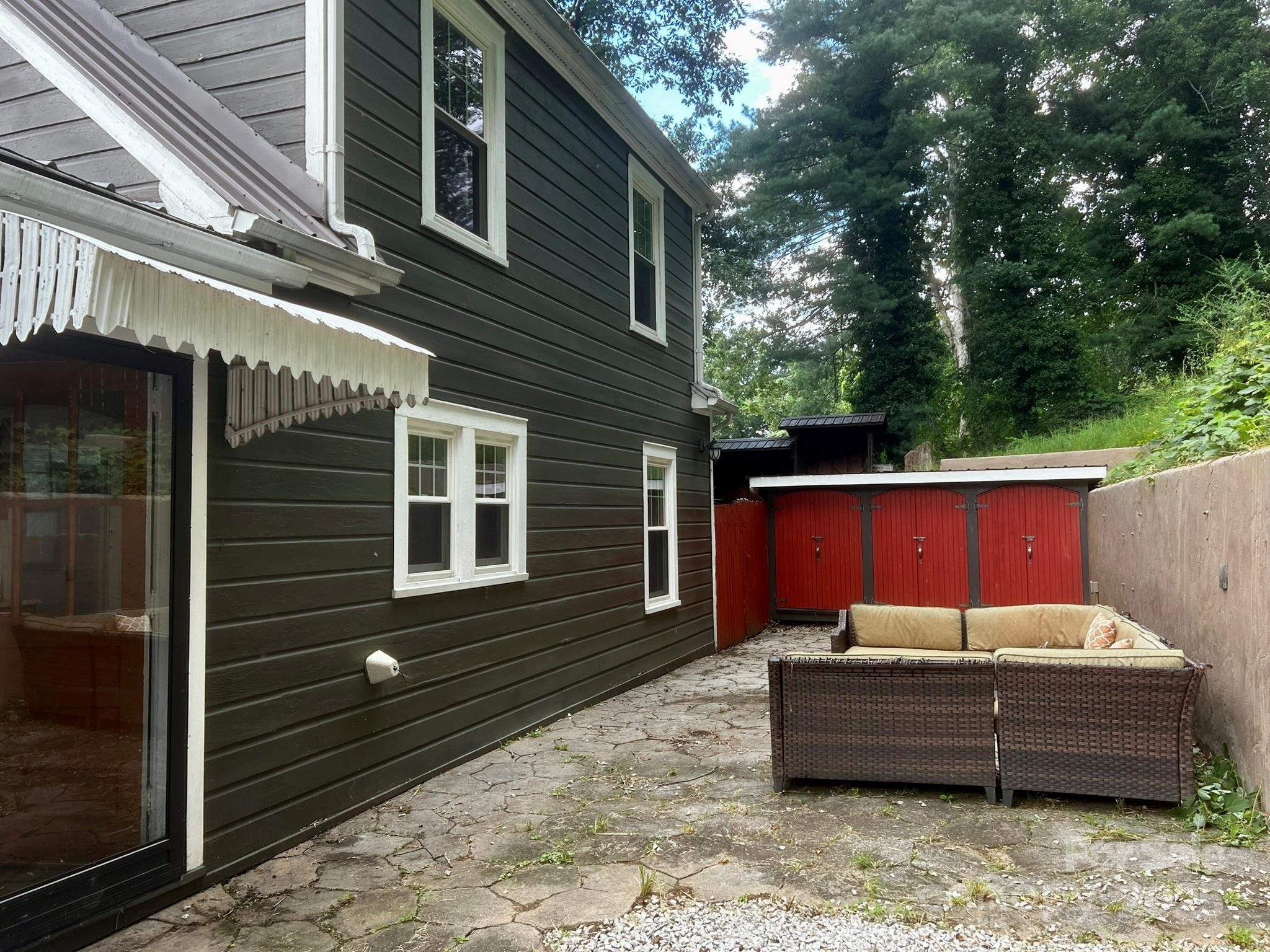 404 Huffman Street Morganton, NC 28655 - Photo 3 of 29 a backyard of a house with a large tree