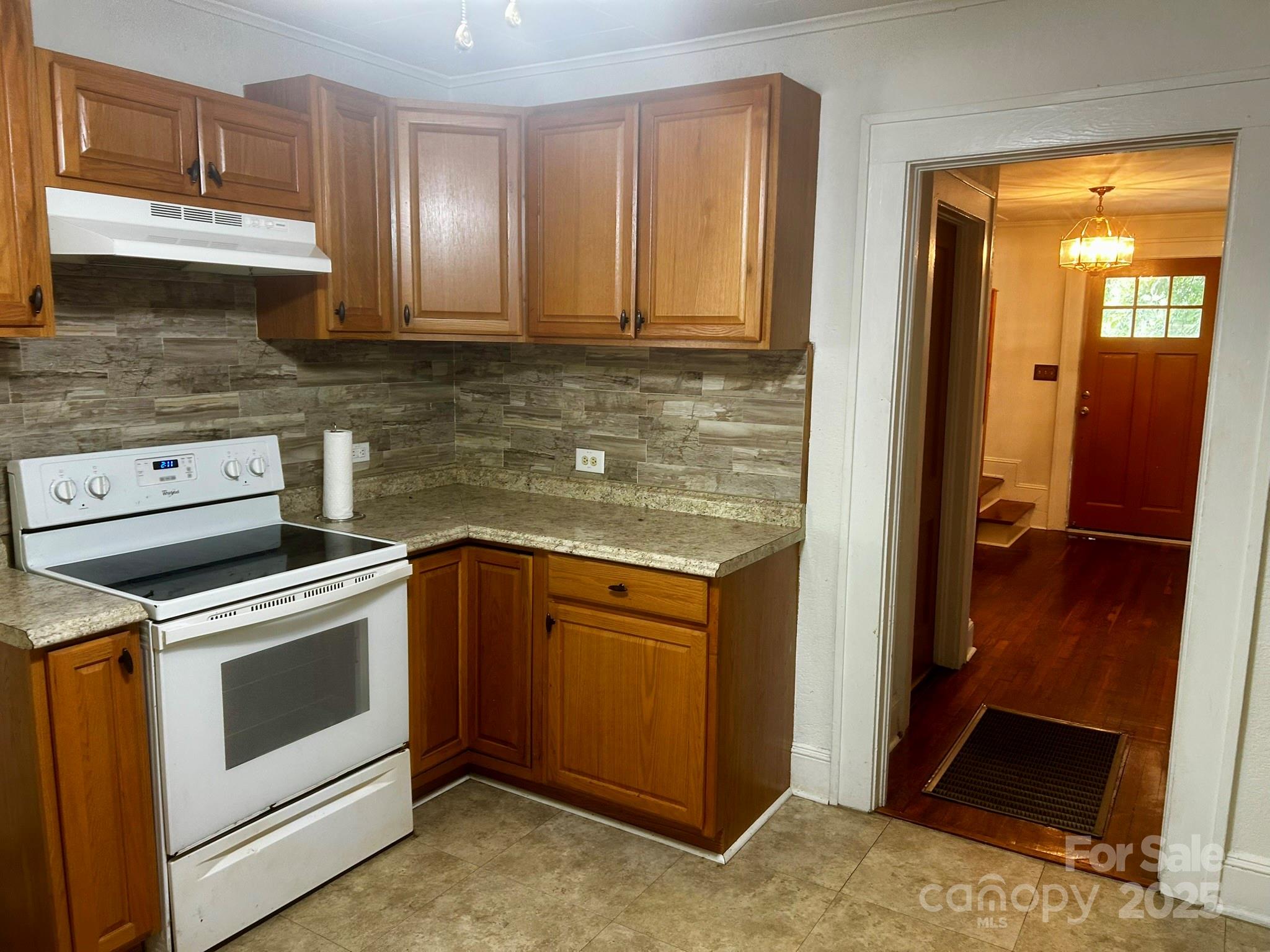 404 Huffman Street Morganton, NC 28655 - Photo 10 of 29 a kitchen with stainless steel appliances granite countertop a stove a sink and a microwave