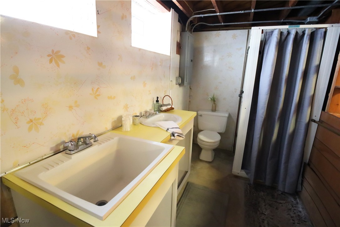 1344 Lander Road Cleveland, OH 44124 - Photo 39 of 49 Bathroom featuring vanity, wallpapered walls, curtained shower, and electric panel