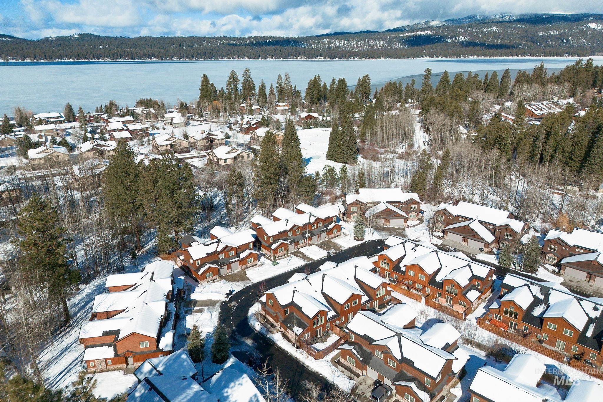 609 Blue Water Circle McCall, ID 83638 - Photo 43 of 45 Snowy aerial view featuring a residential view and a water view