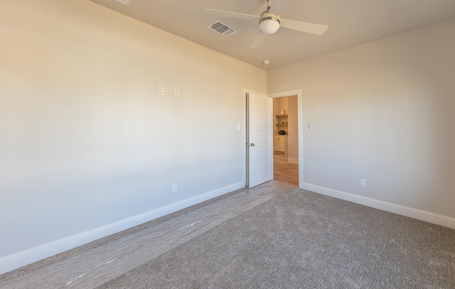 3607 143rd Street Lubbock, TX 79423 - Photo 28 of 35 an empty room with a empty space and a ceiling fan