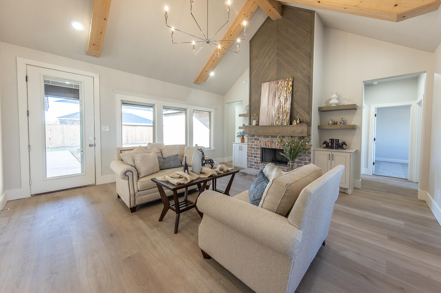 3607 143rd Street Lubbock, TX 79423 - Photo 5 of 35 a living room with furniture and a fireplace
