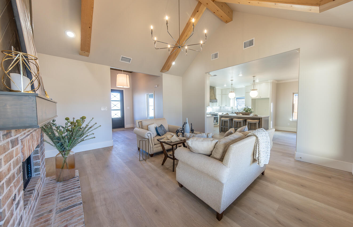3607 143rd Street Lubbock, TX 79423 - Photo 7 of 35 a living room with furniture and a chandelier