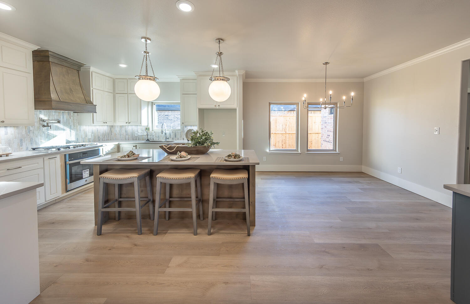 3607 143rd Street Lubbock, TX 79423 - Photo 8 of 35 a large kitchen with a table and chairs
