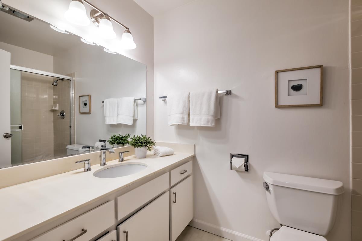 57 Pearce Mitchell Place Stanford, CA 94305 - Photo 11 of 13 a bathroom with a sink a toilet and mirror