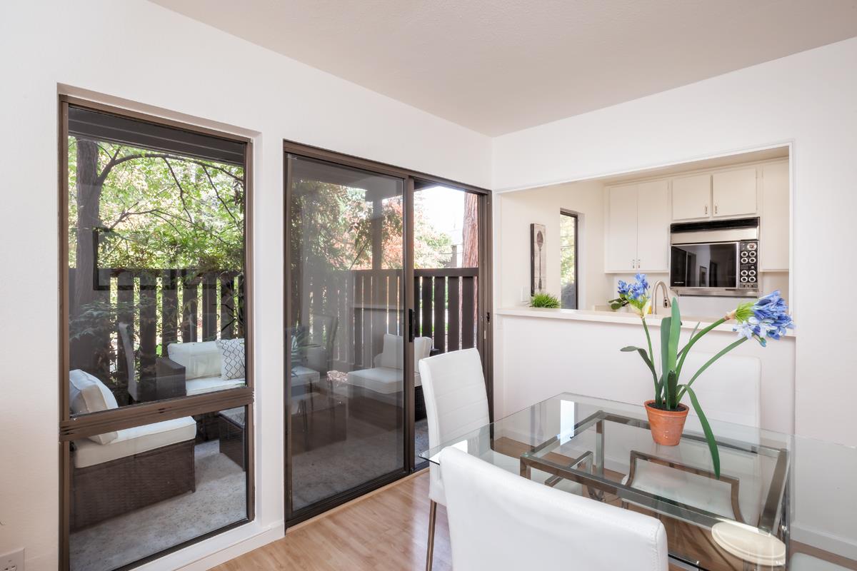 57 Pearce Mitchell Place Stanford, CA 94305 - Photo 7 of 13 a living room with furniture and a floor to ceiling window