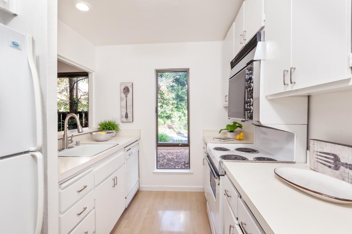 57 Pearce Mitchell Place Stanford, CA 94305 - Photo 8 of 13 a kitchen with granite countertop a sink stove and cabinets