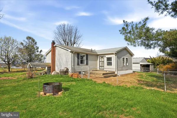 a front view of house with a garden and patio