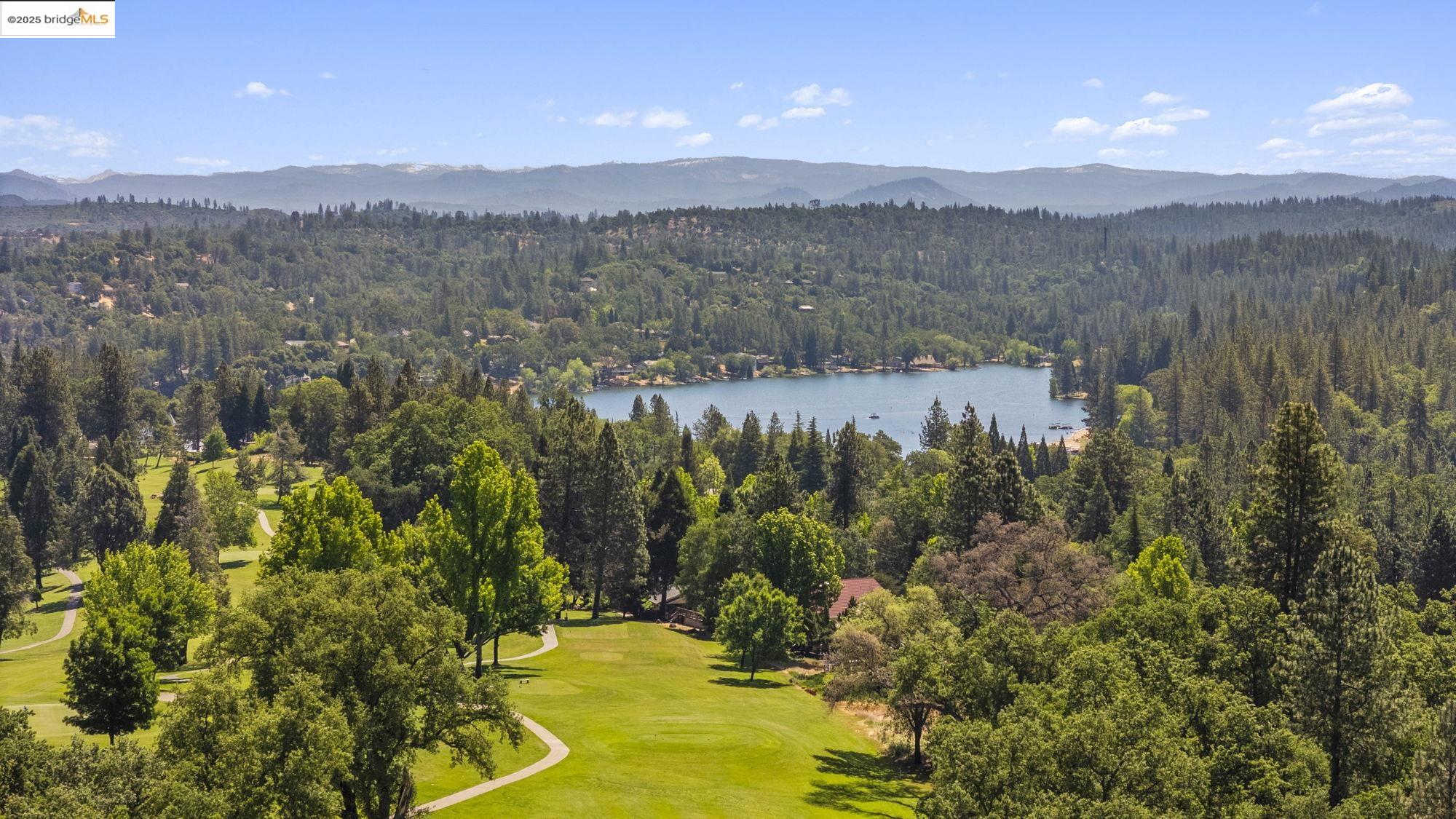 19400 Reid Circle Groveland, CA 95321 - Photo 14 of 60 a view of a lake with a mountain in the background