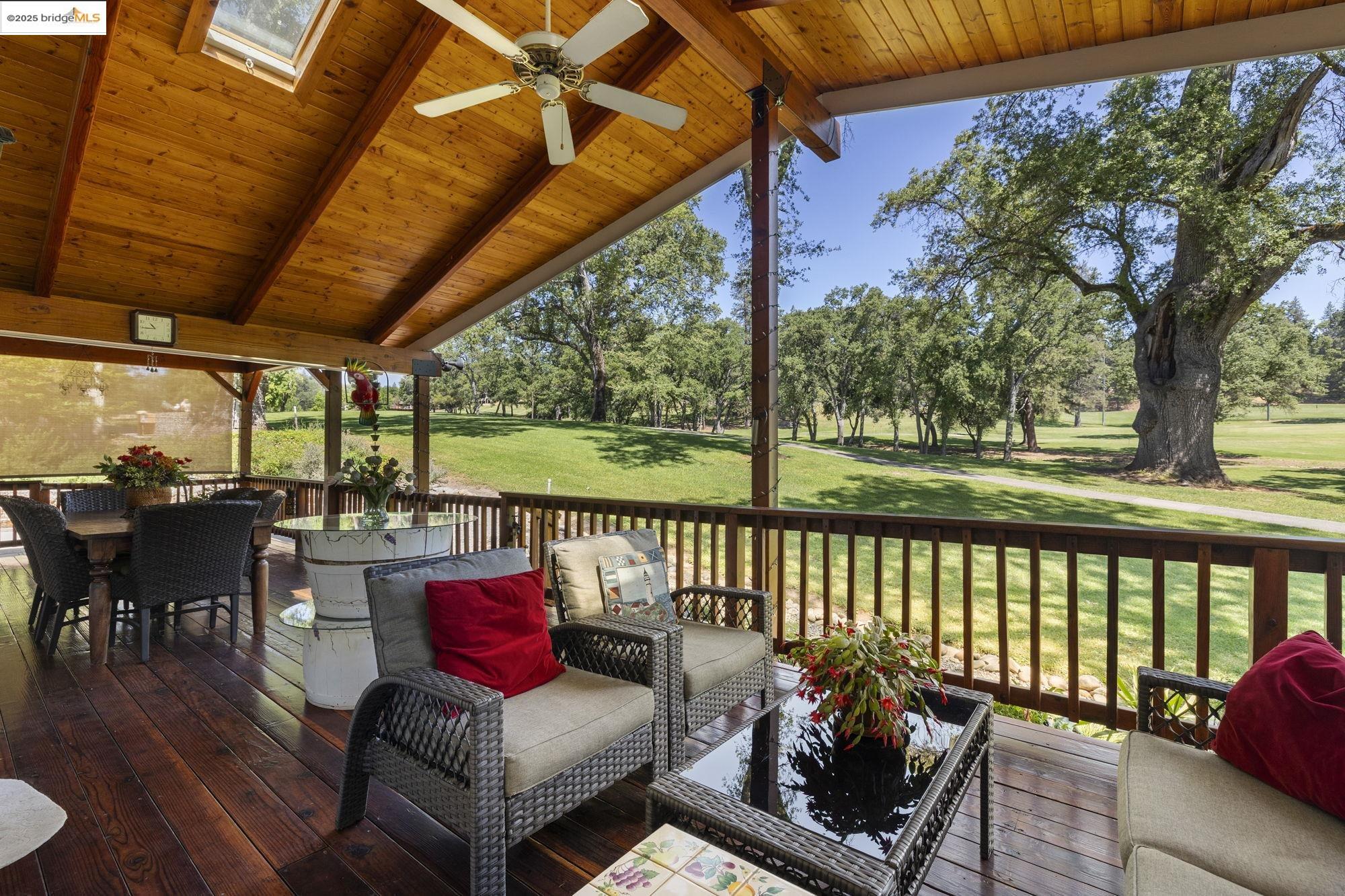 19400 Reid Circle Groveland, CA 95321 - Photo 2 of 60 a balcony with wooden floor and outdoor seating