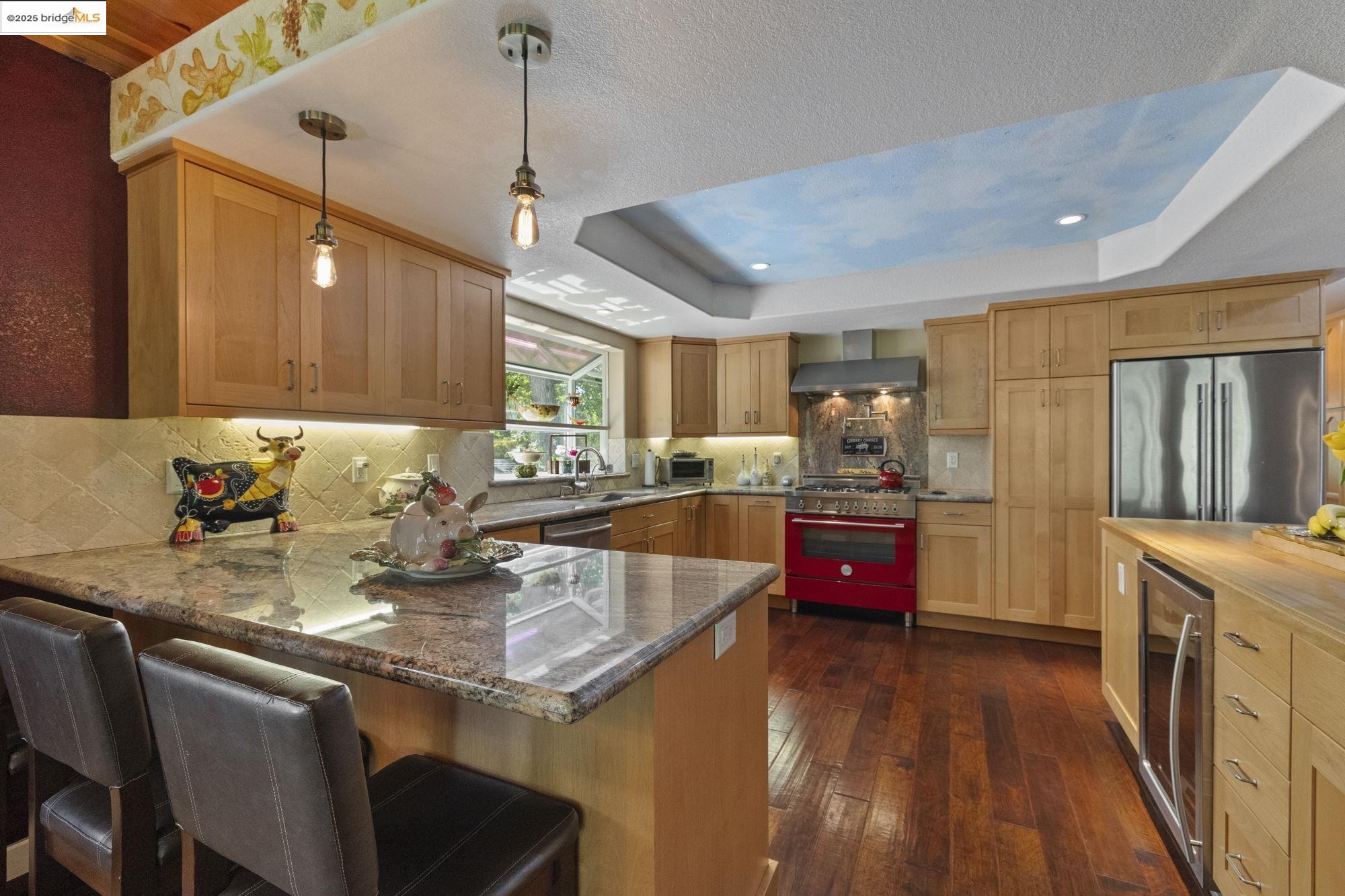 19400 Reid Circle Groveland, CA 95321 - Photo 30 of 60 a kitchen with stainless steel appliances granite countertop a sink a stove top oven a counter space and cabinets